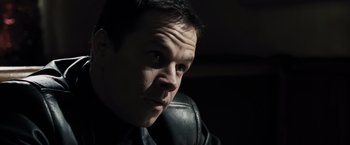 Movie still from “Max Payne” (2008), directed by John Moore – A person wearing a leather jacket; Close Up shot, Low angle