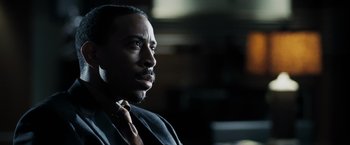 Movie still from “Max Payne” (2008), directed by John Moore – A man in a suit and a tie; Close Up shot, Low angle