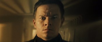 Movie still from “Max Payne” (2008), directed by John Moore – A man's face in a dimly - lit room; Close Up shot, Low angle