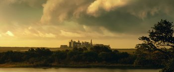 Movie still from “Max Steel” (2016), directed by Stewart Hendler – A view of a large building on top of a hill; Extreme Wide shot, Low angle