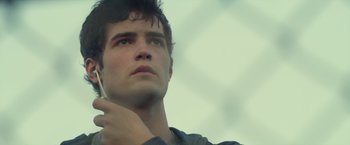 Movie still from “Max Steel” (2016), directed by Stewart Hendler – A person looking up at the sky; Close Up shot, Low angle