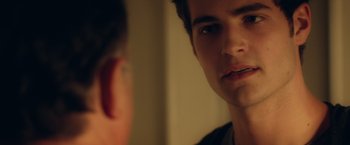 Movie still from “Max Steel” (2016), directed by Stewart Hendler – A man looking at his reflection in a mirror; Close Up shot, Over the shoulder angle