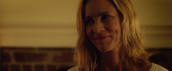 Movie still from “Max Steel” (2016), directed by Stewart Hendler – A woman smiling for the camera; Close Up shot, Over the shoulder angle