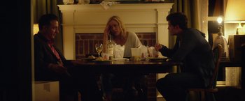 Movie still from “Max Steel” (2016), directed by Stewart Hendler – A woman sitting at a table in front of two men; Medium shot, Over the shoulder angle