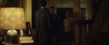 Movie still from “Max Steel” (2016), directed by Stewart Hendler – A group of people standing in front of a mirror; Medium shot, Over the shoulder angle