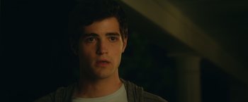 Movie still from “Max Steel” (2016), directed by Stewart Hendler – A young man is looking into the distance; Close Up shot, Over the shoulder angle