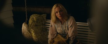 Movie still from “Max Steel” (2016), directed by Stewart Hendler – A woman sitting on a chair in a room; Medium shot, Over the shoulder angle