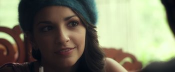 Movie still from “Max Steel” (2016), directed by Stewart Hendler – A woman wearing a blue hat; Close Up shot, Over the shoulder angle