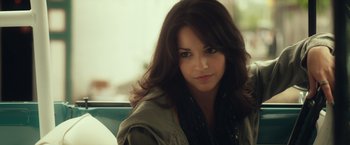 Movie still from “Max Steel” (2016), directed by Stewart Hendler – A woman sitting in a chair looking at the camera; Close Up shot, Over the shoulder angle