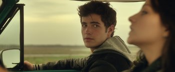 Movie still from “Max Steel” (2016), directed by Stewart Hendler – A man sitting in a car looking out the window; Close Up shot, Over the shoulder angle