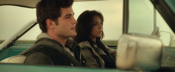 Movie still from “Max Steel” (2016), directed by Stewart Hendler – A man and a woman sitting in the back of a car; Close Up shot, Over the shoulder angle