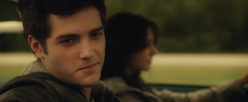 Movie still from “Max Steel” (2016), directed by Stewart Hendler – A man and a woman sitting in the back of a car; Close Up shot, Over the shoulder angle
