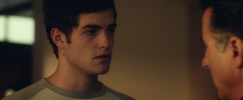 Movie still from “Max Steel” (2016), directed by Stewart Hendler – A young man is looking into the distance; Close Up shot, Over the shoulder angle