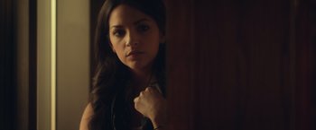 Movie still from “Max Steel” (2016), directed by Stewart Hendler – A beautiful young woman with long dark hair; Close Up shot, Over the shoulder angle