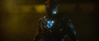 Movie still from “Max Steel” (2016), directed by Stewart Hendler – A person wearing a costume with blue lights; Medium shot, Low angle