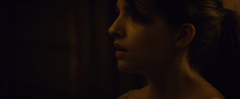 Movie still from “Max Steel” (2016), directed by Stewart Hendler – A woman's face in the dark; Close Up shot, Over the shoulder angle