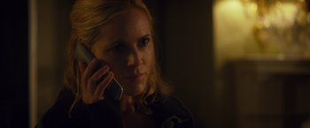Movie still from “Max Steel” (2016), directed by Stewart Hendler – A woman holding a cell phone up to her ear; Close Up shot, Over the shoulder angle