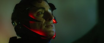 Movie still from “Max Steel” (2016), directed by Stewart Hendler – A person wearing a helmet; Close Up shot, Over the shoulder angle