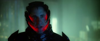 Movie still from “Max Steel” (2016), directed by Stewart Hendler – A person wearing a helmet; Close Up shot, Over the shoulder angle