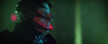 Movie still from “Max Steel” (2016), directed by Stewart Hendler – A man with a red light on his face; Close Up shot, Low angle