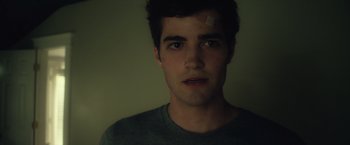 Movie still from “Max Steel” (2016), directed by Stewart Hendler – A man with a bandage on his forehead; Close Up shot, Over the shoulder angle