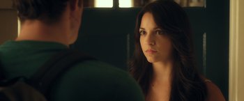 Movie still from “Max Steel” (2016), directed by Stewart Hendler – A woman looking at a man in the mirror; Close Up shot, Over the shoulder angle