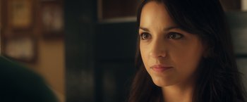 Movie still from “Max Steel” (2016), directed by Stewart Hendler – A woman's face in a dark room; Close Up shot, Over the shoulder angle