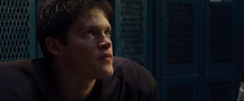 Movie still from “McFarland, USA” (2015), directed by Niki Caro – A young man looking up into the air; Close Up shot, Low angle