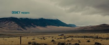 Movie still from “McFarland, USA” (2015), directed by Niki Caro – A truck is parked in the middle of the desert; Extreme Wide shot, Low angle