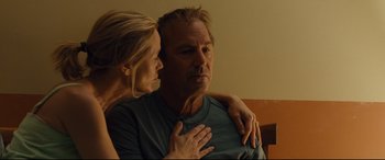 Movie still from “McFarland, USA” (2015), directed by Niki Caro – A man and a woman sitting next to each other; Close Up shot, Low angle