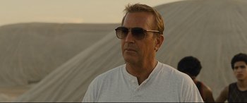 Movie still from “McFarland, USA” (2015), directed by Niki Caro – A person wearing sunglasses and a white shirt; Close Up shot, Low angle