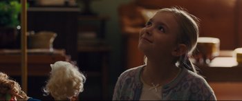 Movie still from “McFarland, USA” (2015), directed by Niki Caro – A little girl looking up into the sky; Close Up shot, Over the shoulder angle