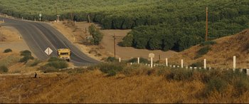 Movie still from “McFarland, USA” (2015), directed by Niki Caro – An empty road in the middle of a field; Extreme Wide shot, High angle