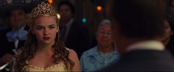 Movie still from “McFarland, USA” (2015), directed by Niki Caro – A woman wearing a tiara standing in front of an older woman; Close Up shot, Over the shoulder angle