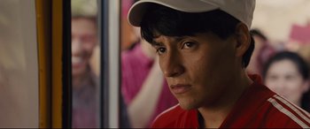 Movie still from “McFarland, USA” (2015), directed by Niki Caro – A person wearing a hat; Close Up shot, Over the shoulder angle