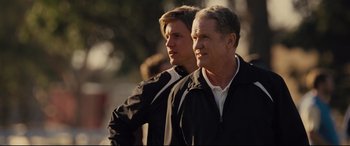 Movie still from “McFarland, USA” (2015), directed by Niki Caro – A man and a boy standing next to each other; Close Up shot, Over the shoulder angle