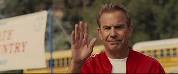 Movie still from “McFarland, USA” (2015), directed by Niki Caro – A person with his hand raised up; Close Up shot, Over the shoulder angle