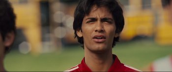 Movie still from “McFarland, USA” (2015), directed by Niki Caro – A person wearing a soccer uniform; Close Up shot, Low angle