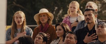 Movie still from “McFarland, USA” (2015), directed by Niki Caro – A group of people that are sitting in the stands; Medium shot, Over the shoulder angle