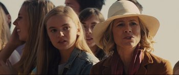 Movie still from “McFarland, USA” (2015), directed by Niki Caro – A group of people standing next to each other in a crowd; Close Up shot, Over the shoulder angle
