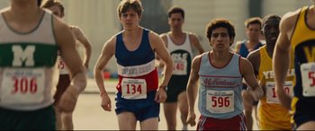 Movie still from “McFarland, USA” (2015), directed by Niki Caro – A group of young men running in a race; Medium shot, Over the shoulder angle