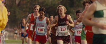 Movie still from “McFarland, USA” (2015), directed by Niki Caro – A group of young men running a cross country race; Medium shot, High angle
