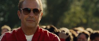 Movie still from “McFarland, USA” (2015), directed by Niki Caro – A person wearing sunglasses and a red shirt; Close Up shot, Low angle