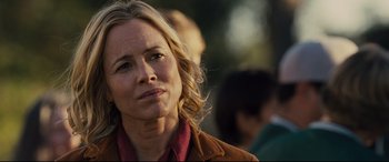 Movie still from “McFarland, USA” (2015), directed by Niki Caro – A person wearing a brown jacket; Close Up shot, Over the shoulder angle