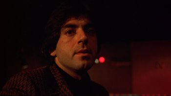 Movie still from “Mean Streets” (1973), directed by Martin Scorsese – A person wearing a jacket; Close Up shot, Low angle