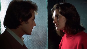 Movie still from “Mean Streets” (1973), directed by Martin Scorsese – A man and a woman face to face in front of a window; Close Up shot, Over the shoulder angle