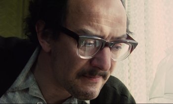 Movie still from “Meantime” (1983), directed by Mike Leigh – A person wearing glasses; Close Up shot, Low angle