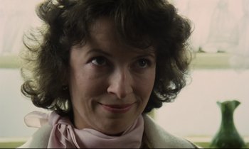 Movie still from “Meantime” (1983), directed by Mike Leigh – A person wearing a pink scarf; Close Up shot, Low angle