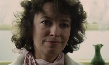 Movie still from “Meantime” (1983), directed by Mike Leigh – A person wearing a pink scarf; Close Up shot, Low angle