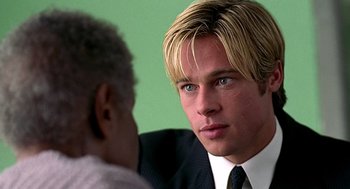 Movie still from “Meet Joe Black” (1998), directed by Martin Brest – A man in a suit and tie talking to another man in a suit and tie; Close Up shot, Over the shoulder angle